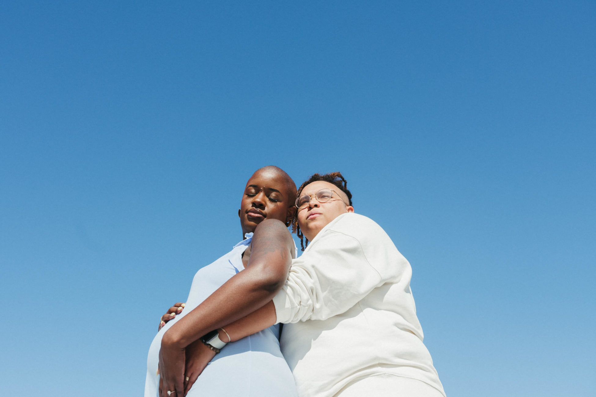 Black non-binary couple on their rooftop in Philly In-Home Maternity Session