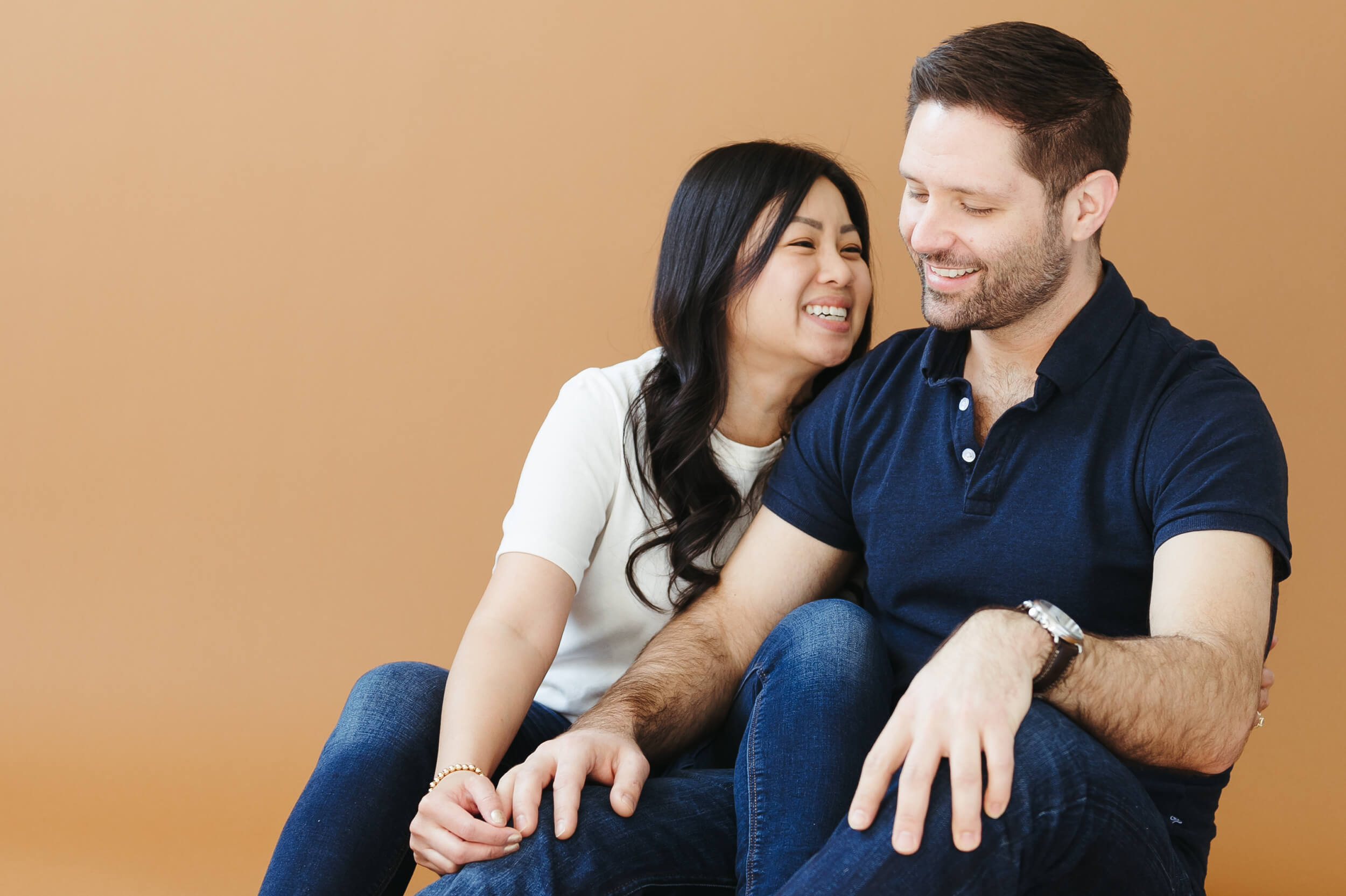 Jen and Griff laughing and having a great time during their couples studio session prior to their wedding day