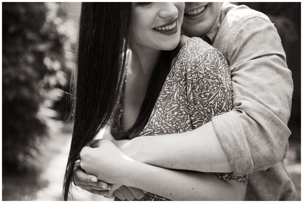 A close up photo in black and white of the couple smiling in engagement photos in Philadelphia
