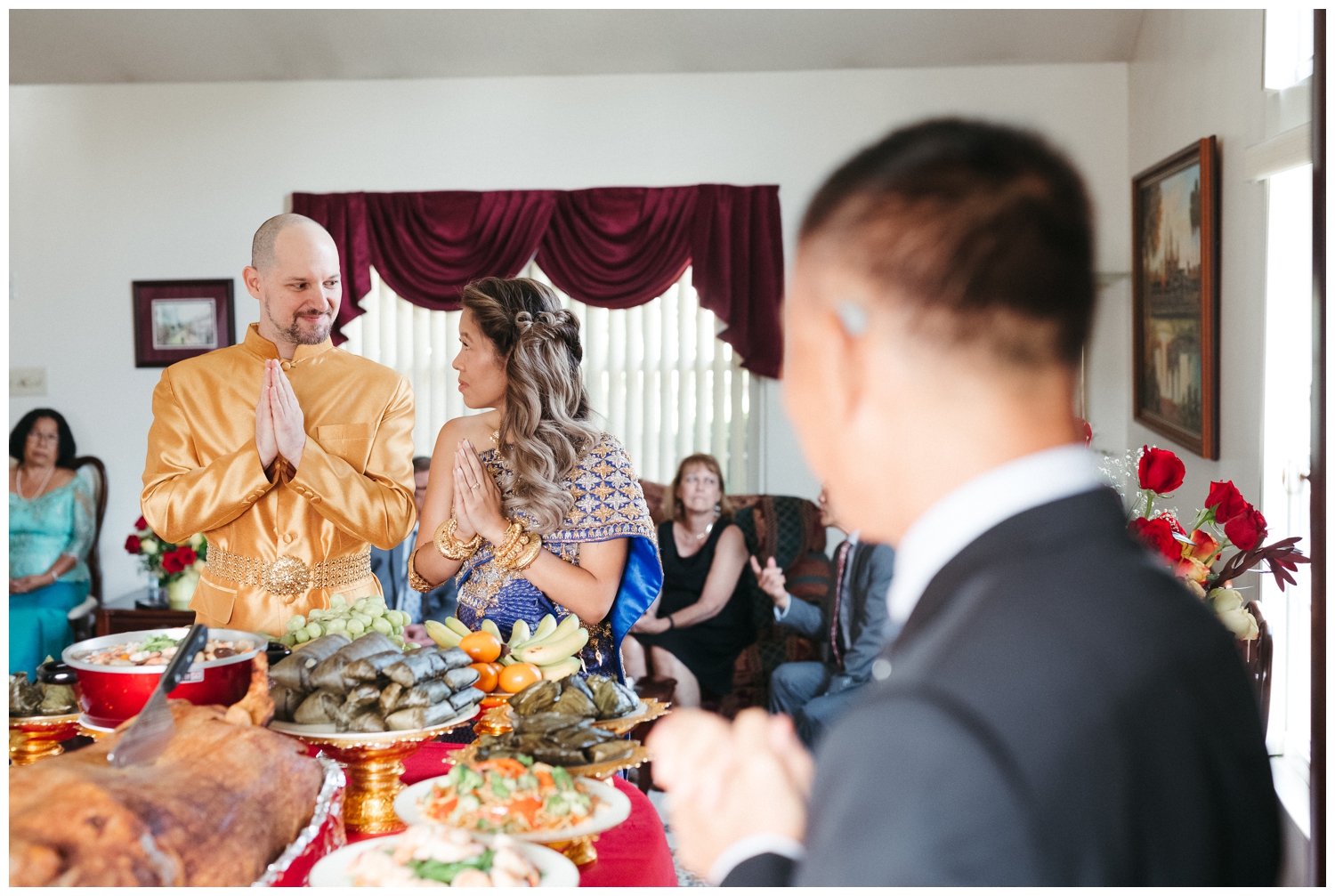 A couple stands by a table during a Cambodian micro wedding Philadelphia