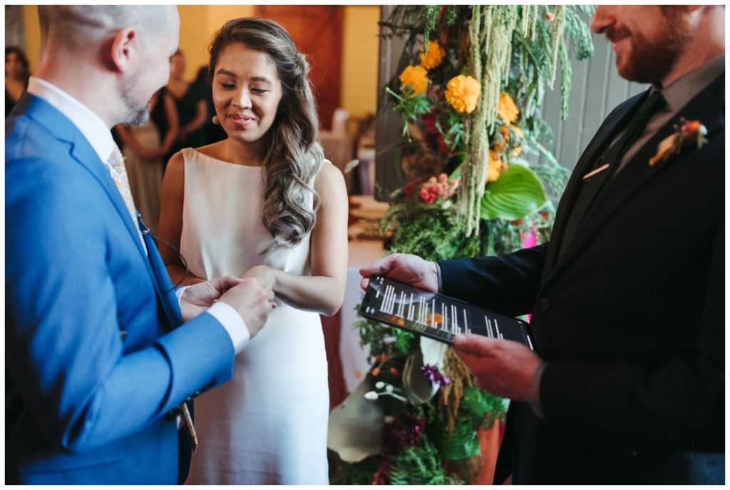 The couple exchanges rings at their micro wedding in Philadelphia