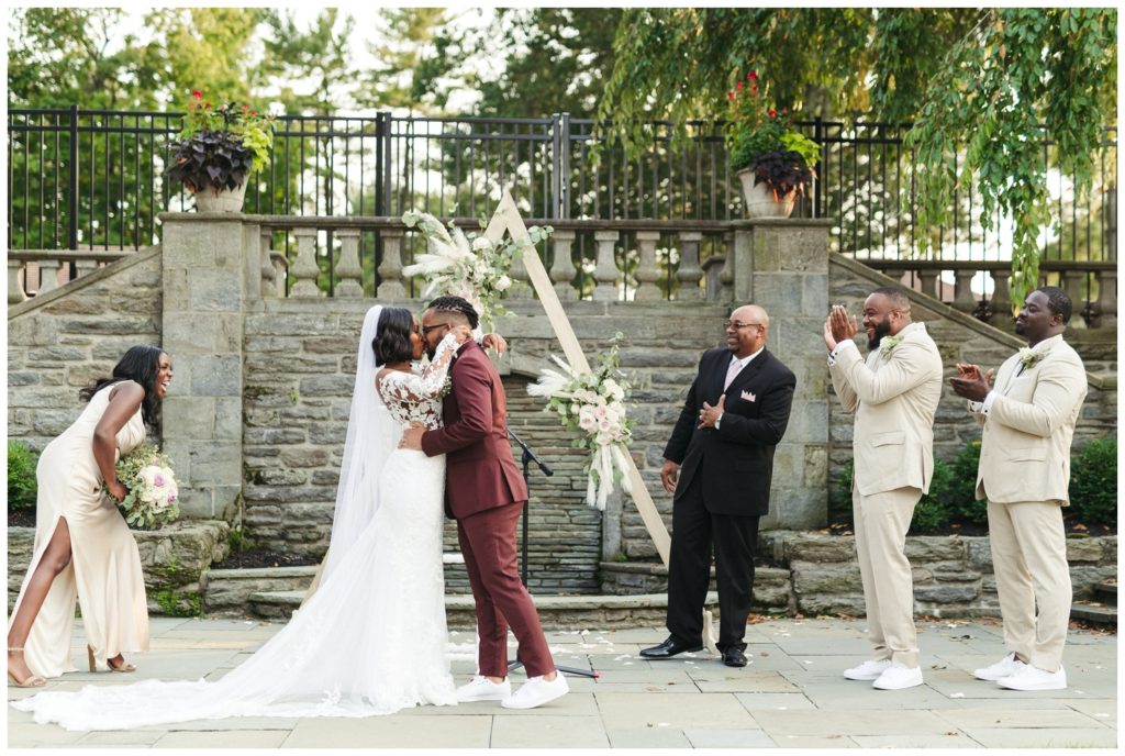 The couple's first kiss in wedding photography in philadelphia