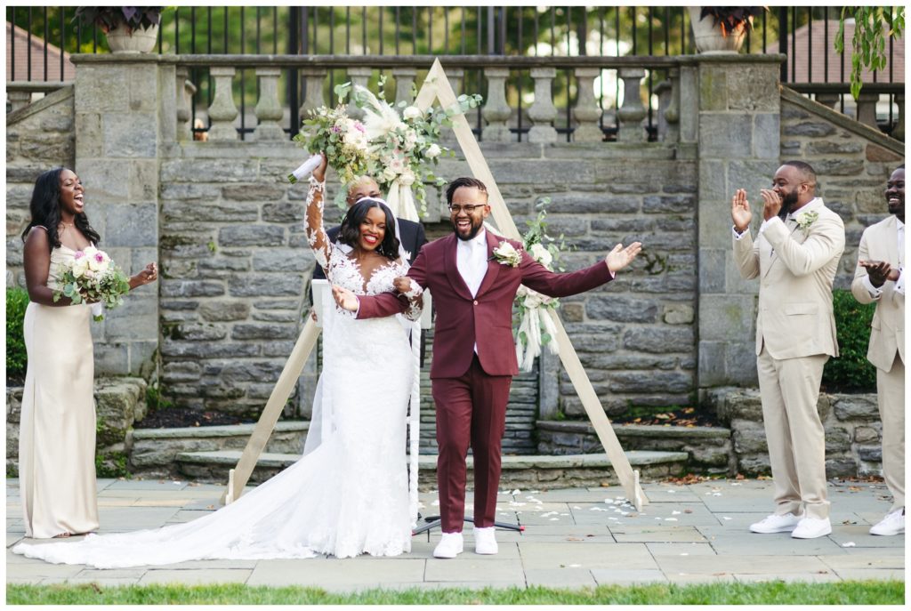 Bride and groom cheer in wedding photography in philadelphia