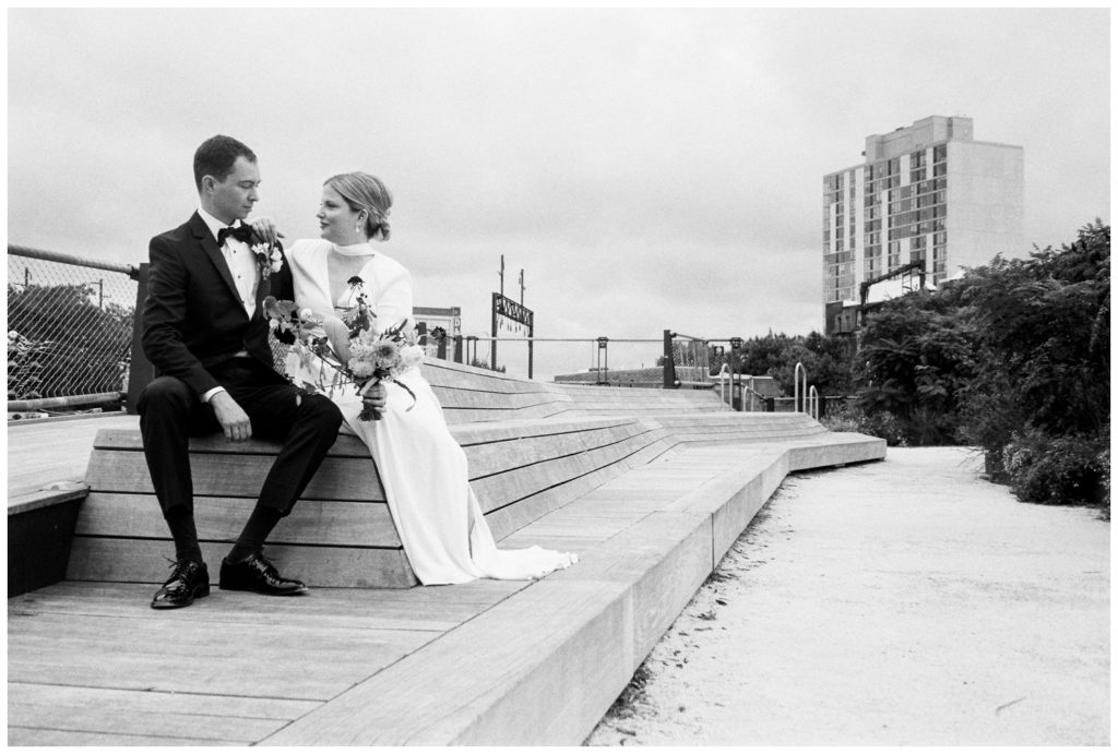 The couple sits at Rail Park before their nontraditional wedding