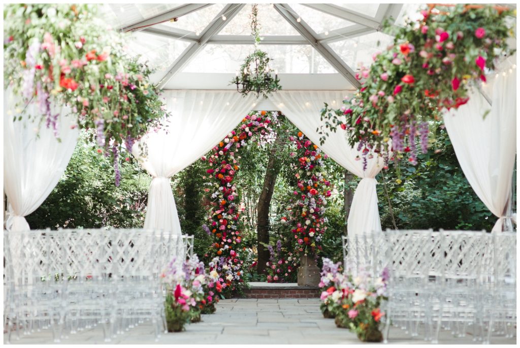 The ceremony for a Philadelphia micro wedding has a floral arch