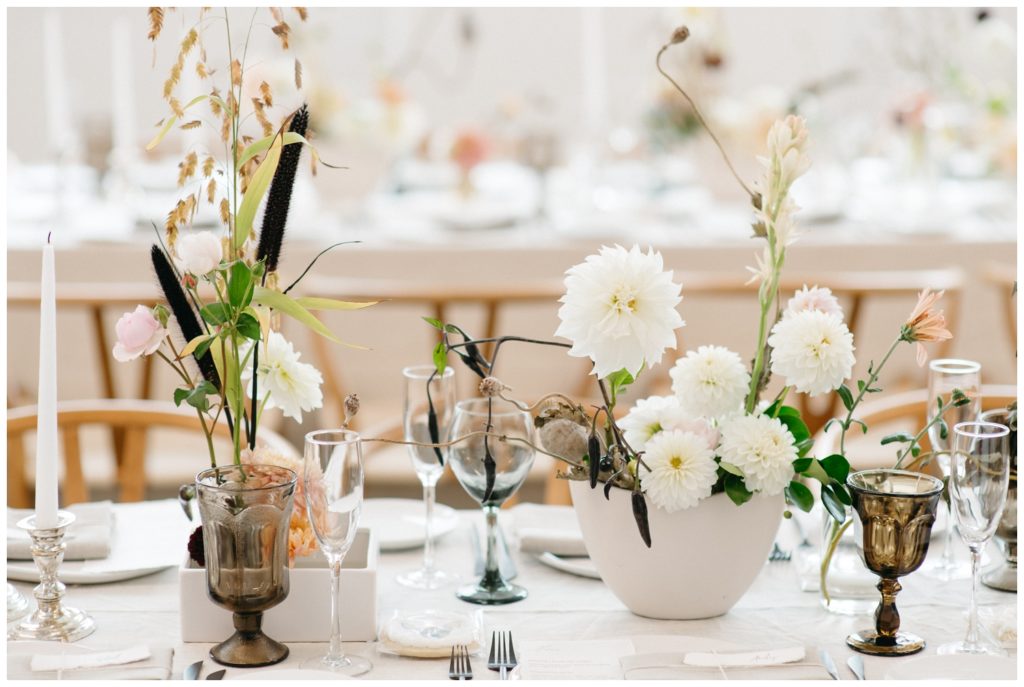 White flowers in cream vases at the Philadelphia micro wedding