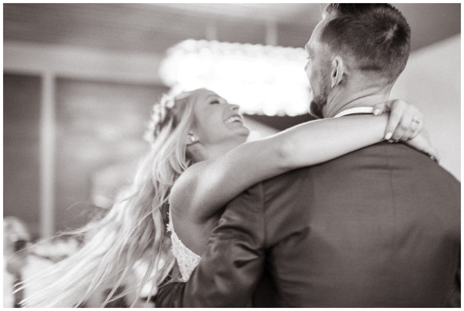 The bride's hair flies behind her at the Promise Ridge wedding