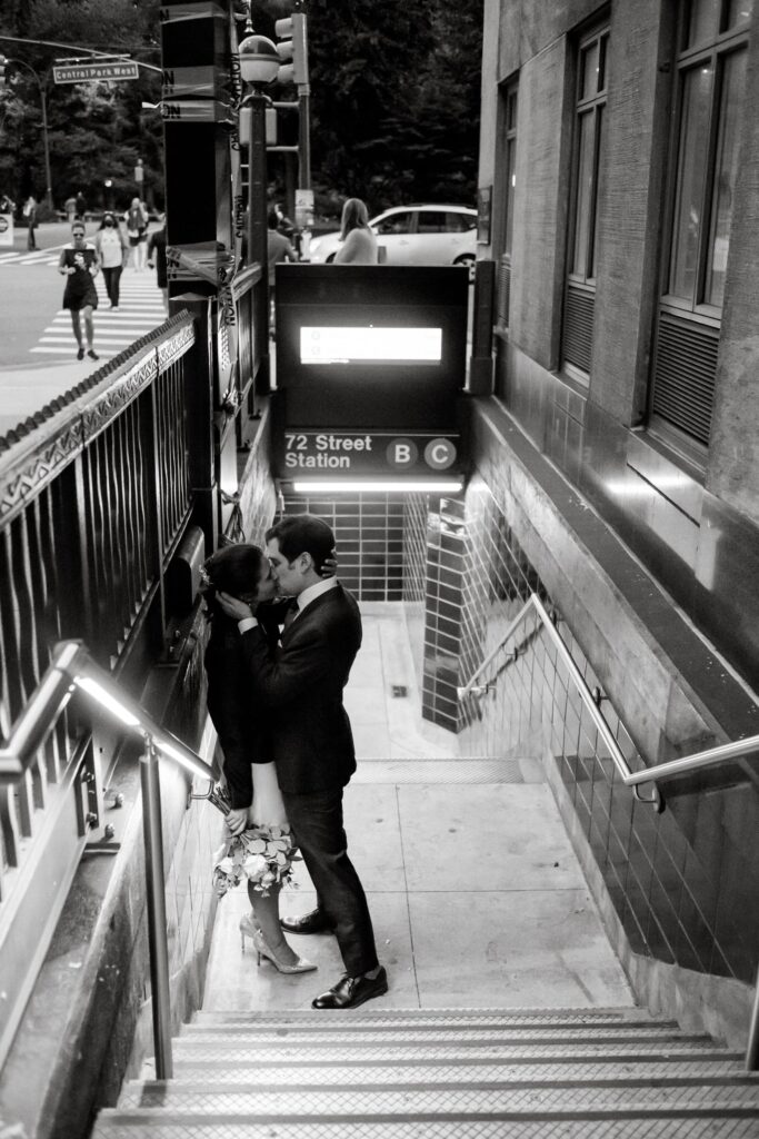 Lauren and Josh steal a kiss on the subway platform during their Central Park Elopement