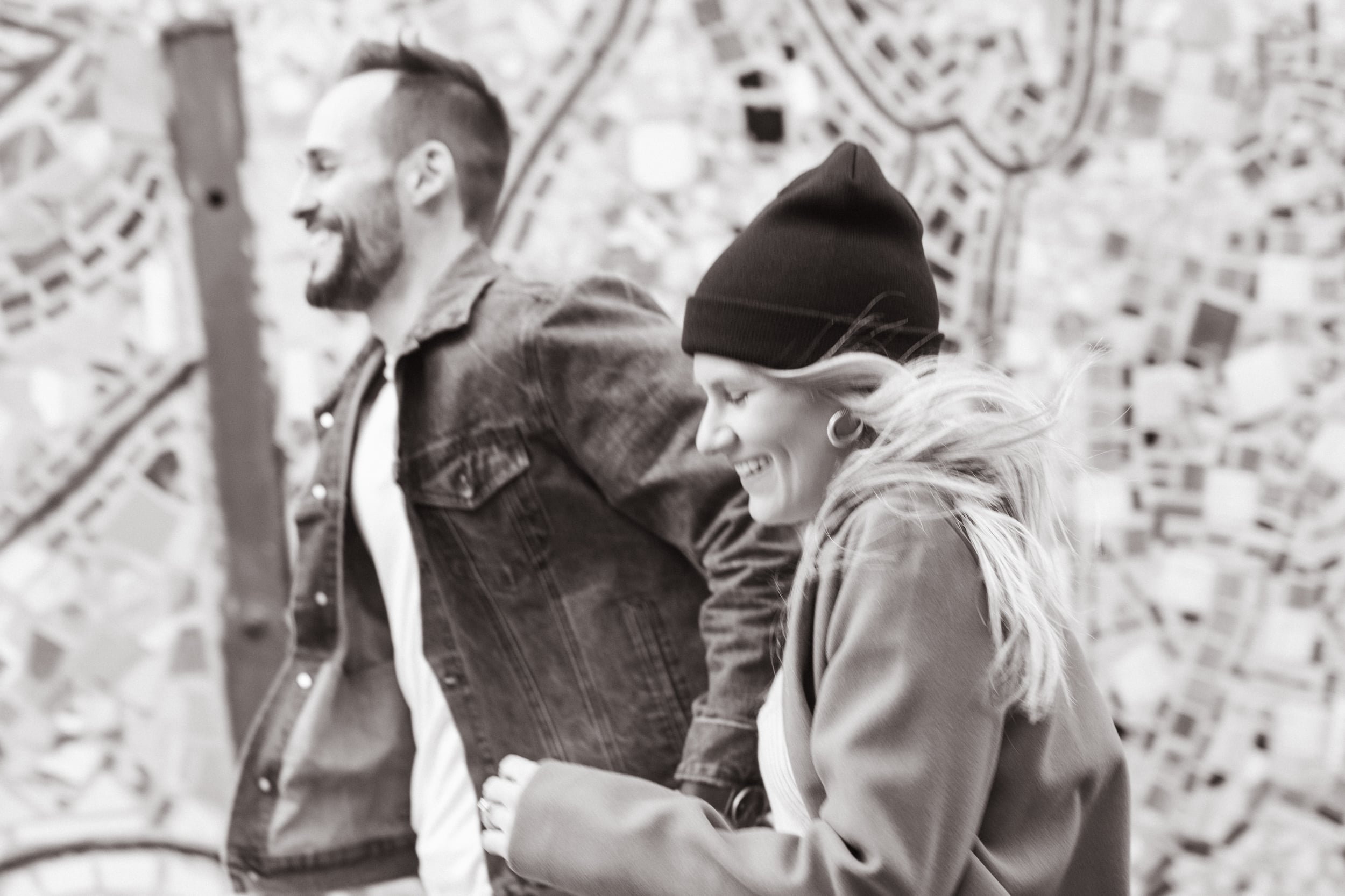 Couple runs down South Street during their Philadelphia Engagement Session