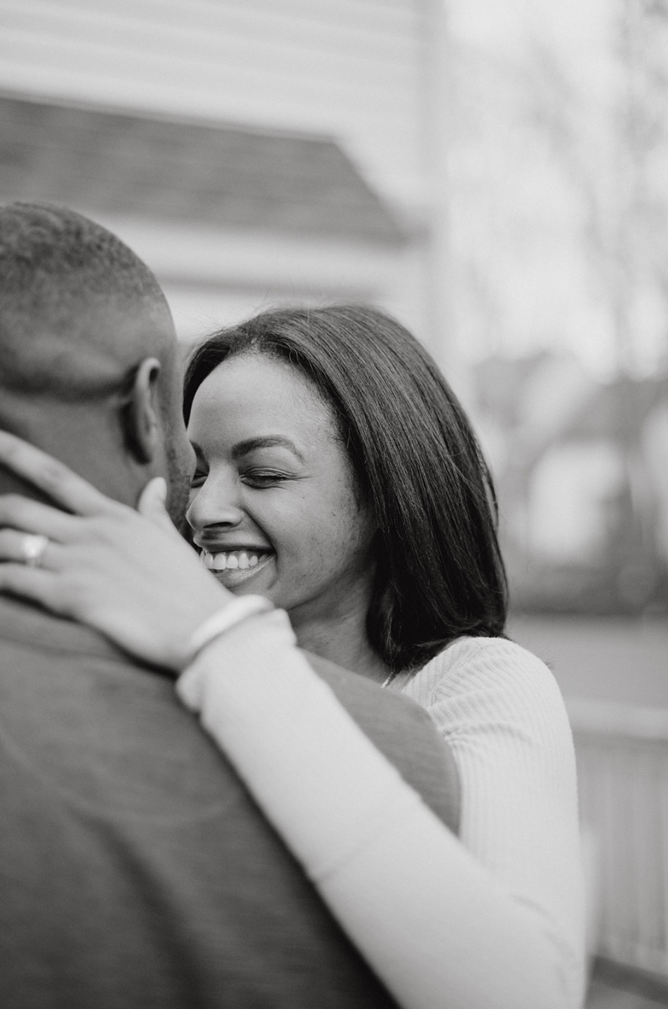 Black and white photo of couple sharing an embrace during their location engagement shoot