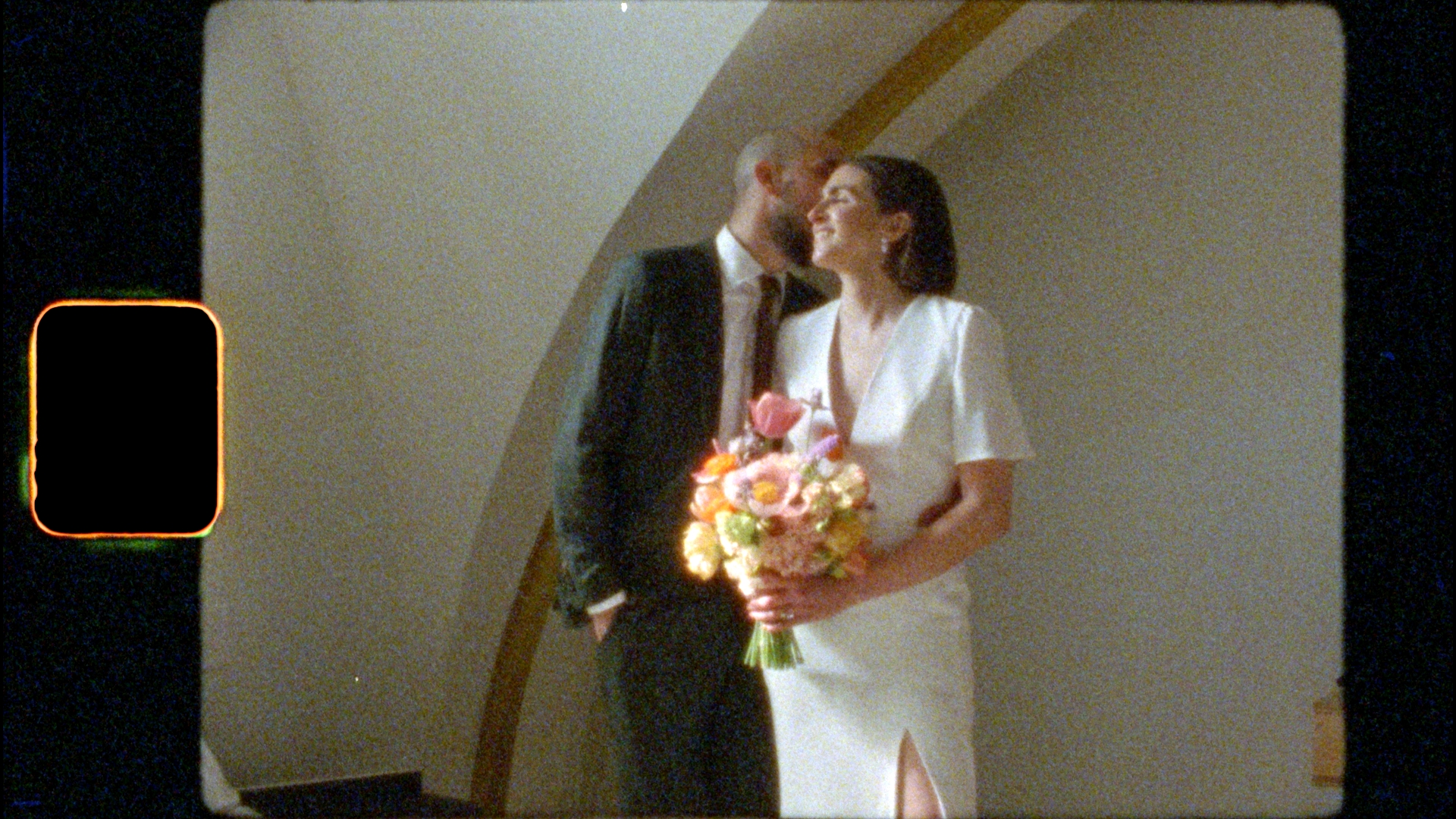 5 Reasons to Go with a Super 8 Wedding Film: Bride and groom smile during their wedding film shoot with Jason Moody Photography.