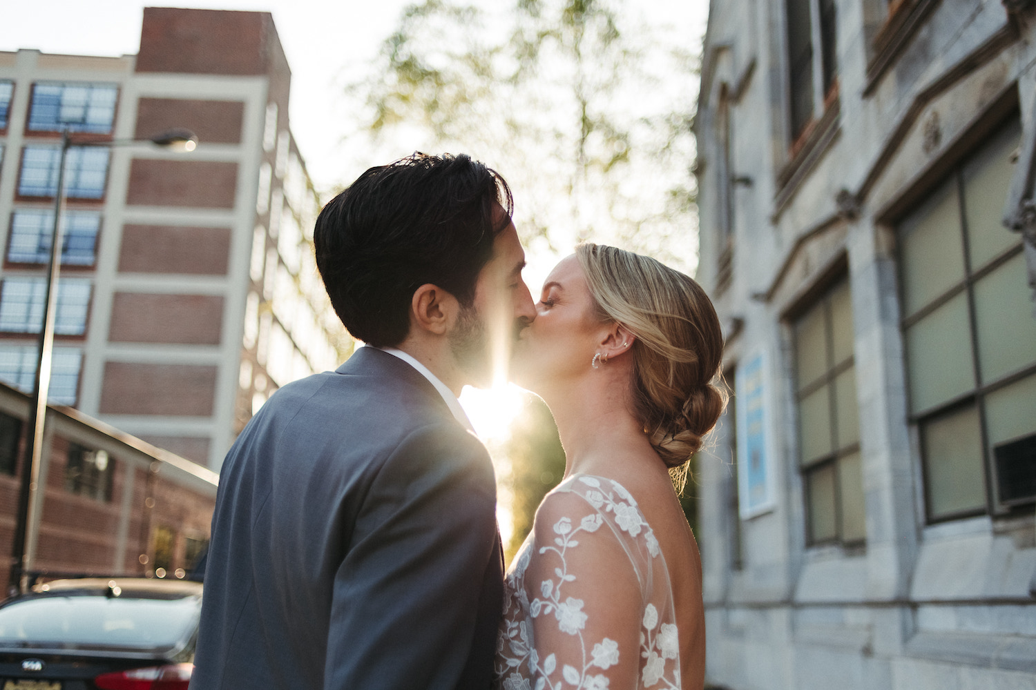 Bride and groom sharing a kiss during their wedding shoot with film photographer Jason Moody