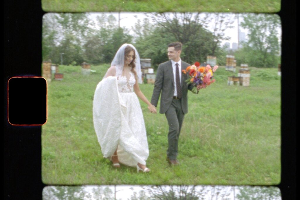 Bride and groom holding hands as they walk during their Bartram's Garden Wedding Shoot on Super 8 Film, captured by Jason Moody Photography