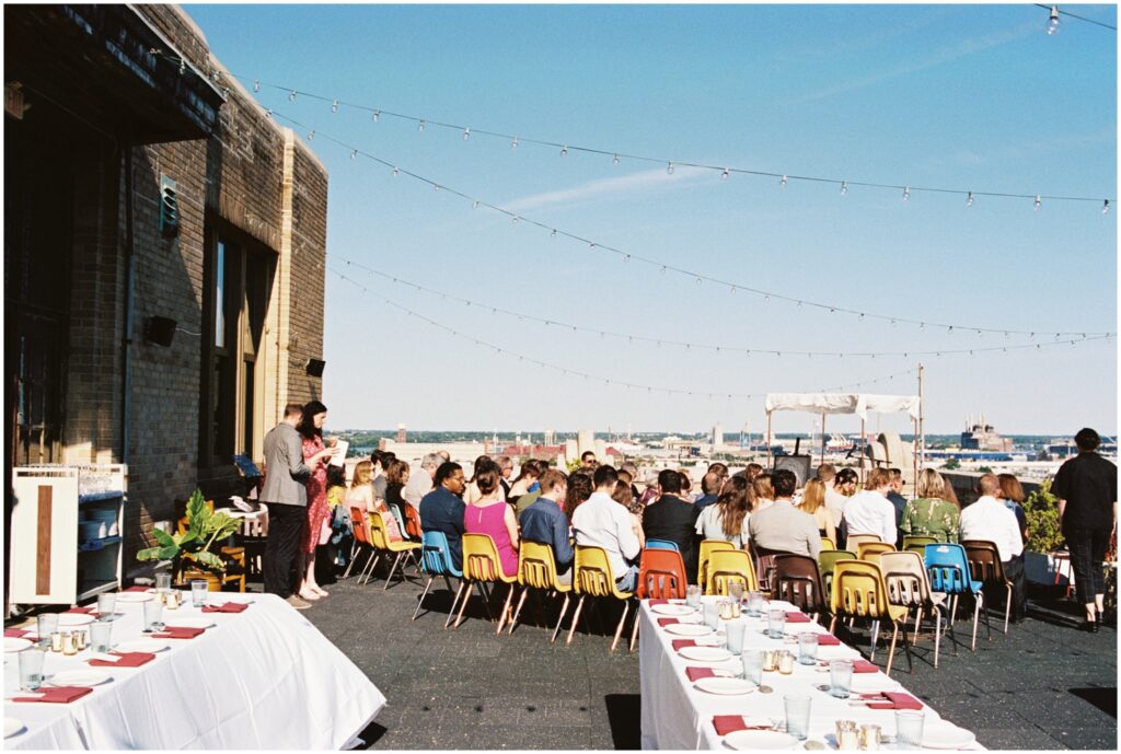 Guests sit for the rooftop wedding in Philadelphia.