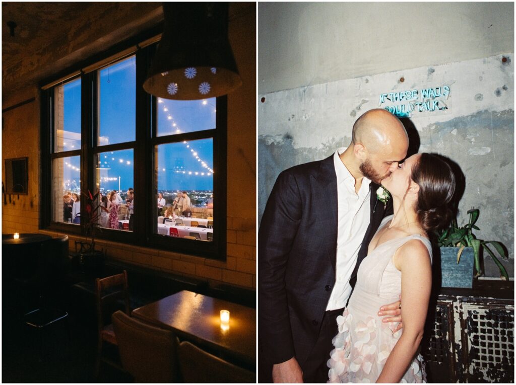 A bride and groom kiss while their guests dance on the rooftop at Irwin's.