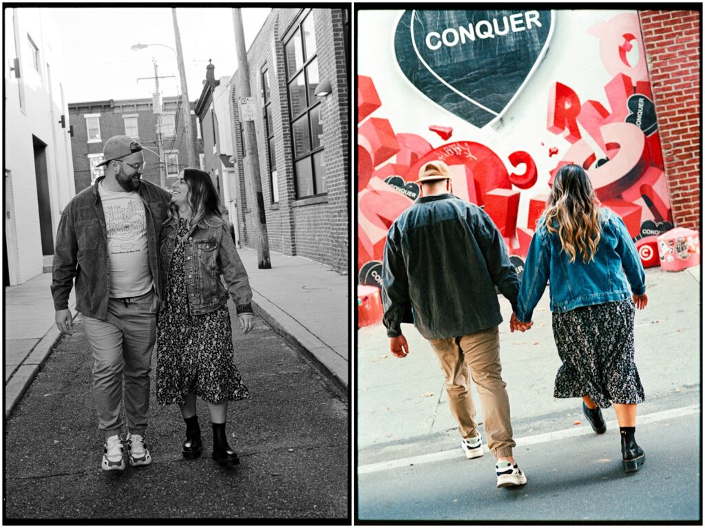 A couple walks towards a mural in a Philadelphia engagement photo.