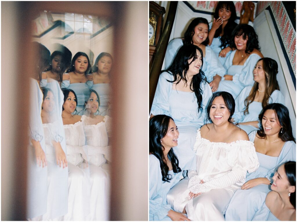 A bride sits on a staircase surrounded by her bridesmaids.