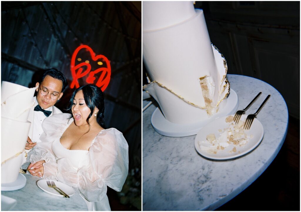 A bride and groom cut their wedding cake beneath a custom neon wedding sign.