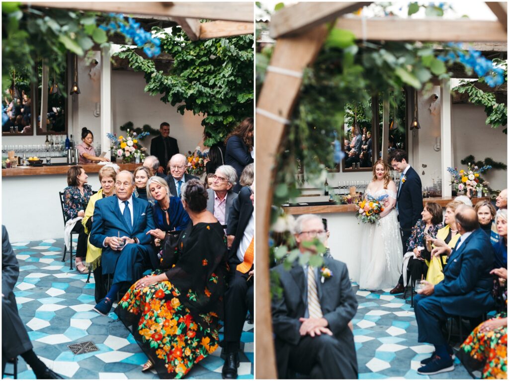 A bride and groom enter the Suraya courtyard where their guests are seated for the wedding ceremony.