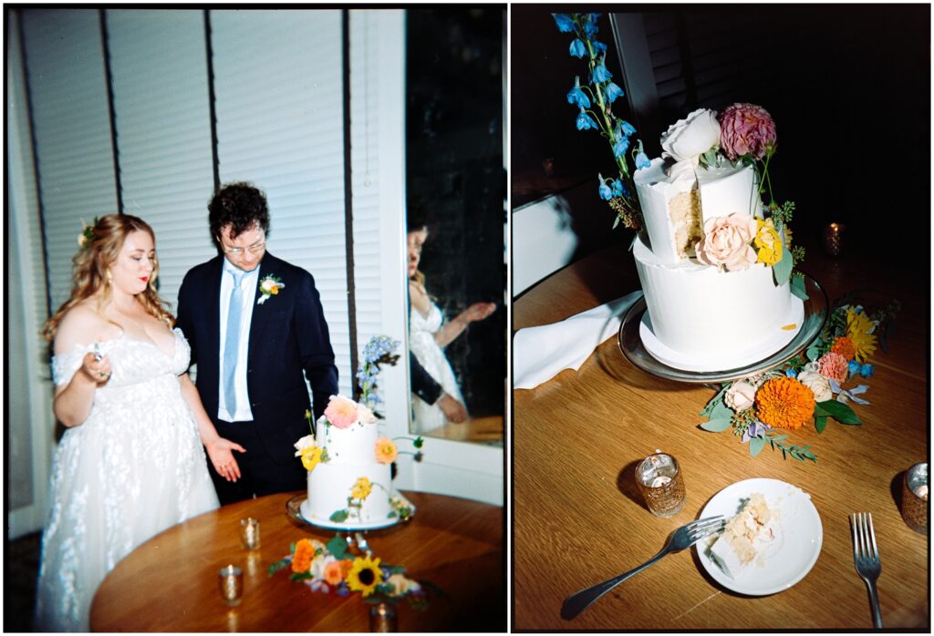 A slice of wedding cake sits on a table beside a cake decorated with flowers.