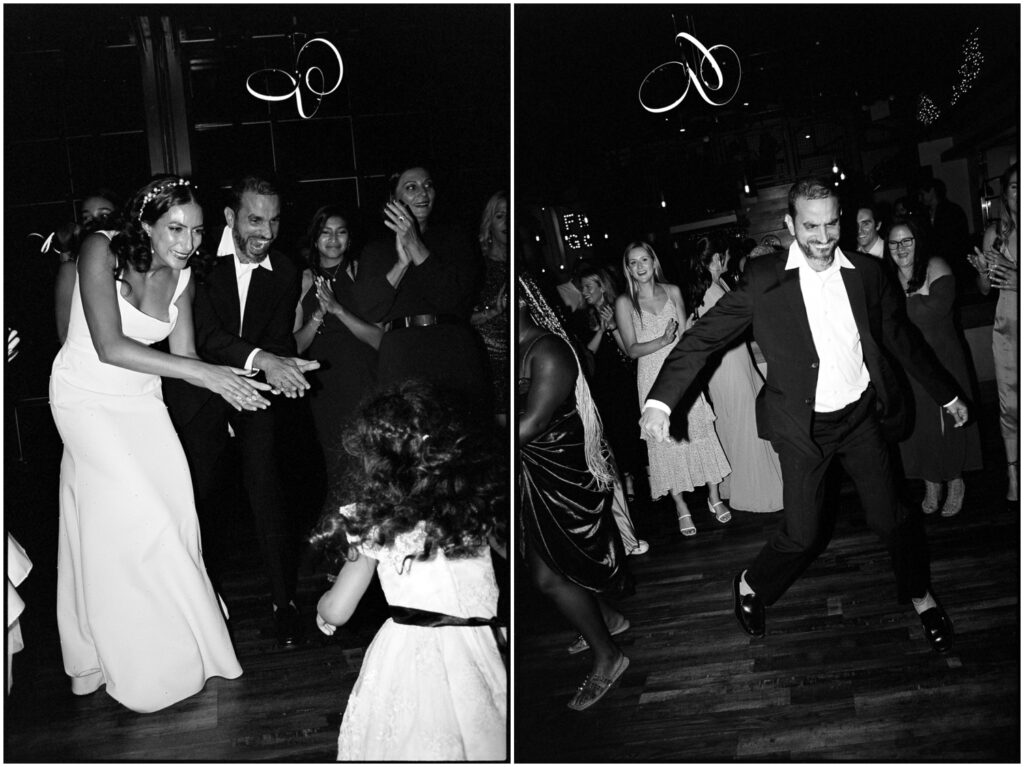 A wedding guest kicks his feet on the dance floor.