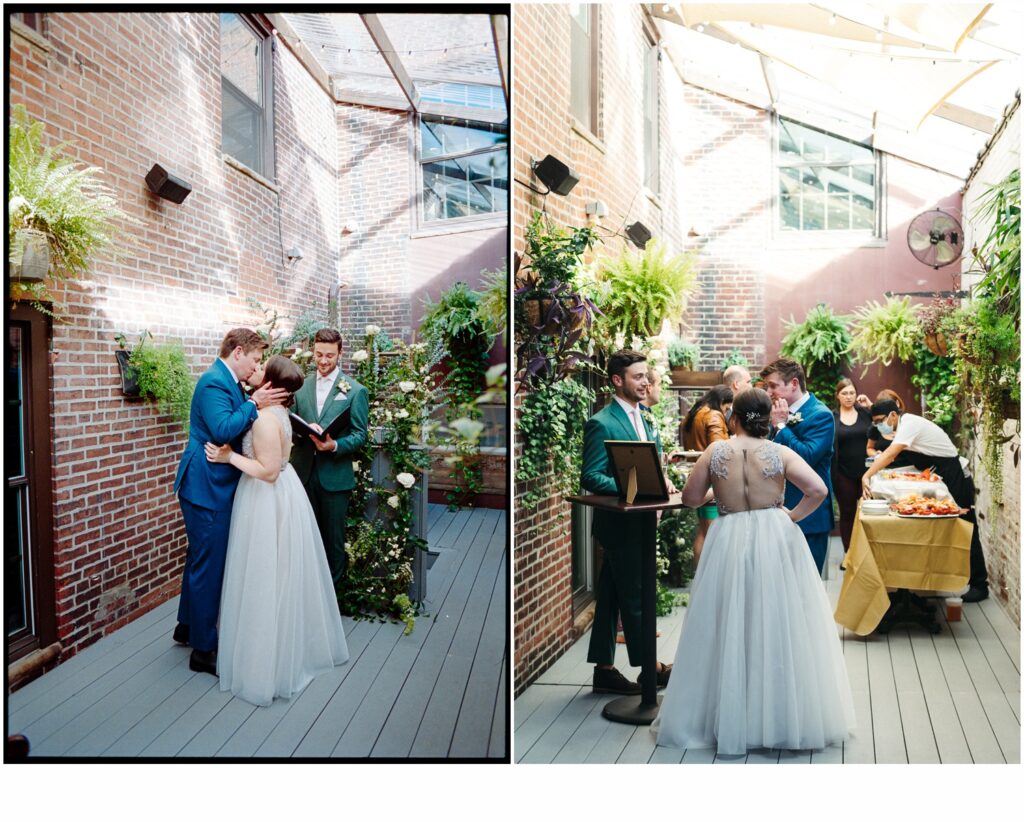 A bride and groom kiss at the end of their restaurant wedding ceremony.