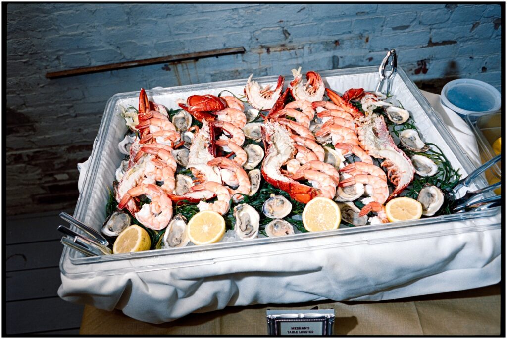 A tray of seafood sits on a cocktail hour buffet as an idea for how to have a small wedding.