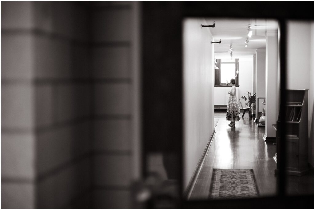 A bride stands in a hallway of the BOK Building.
