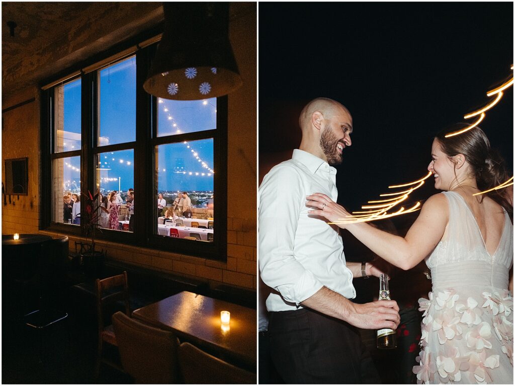 Through a window, wedding guests gather for a Philadelphia rooftop wedding reception.