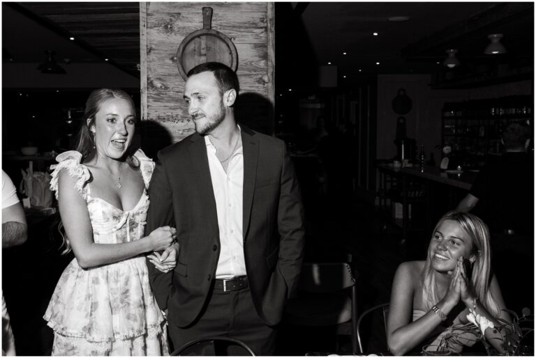 A bride and groom give a speech to their guests at their rehearsal dinner in Philadelphia.