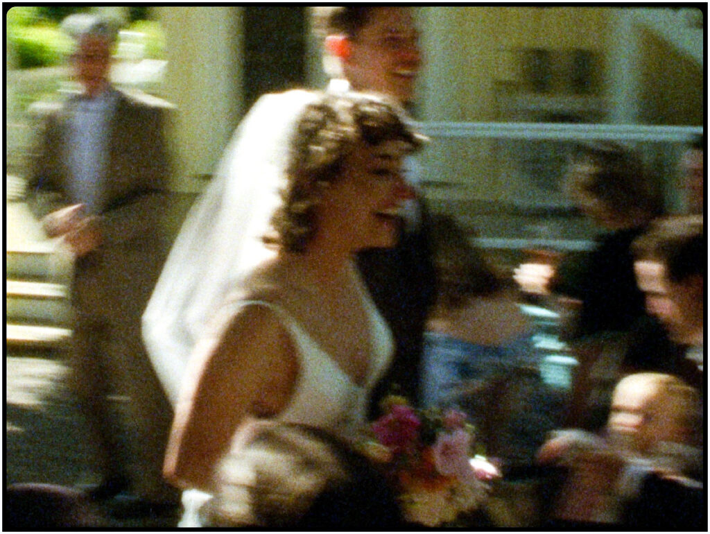 Wedding couple laughing as they exit their ceremony at their destination wedding on Super 8 video.