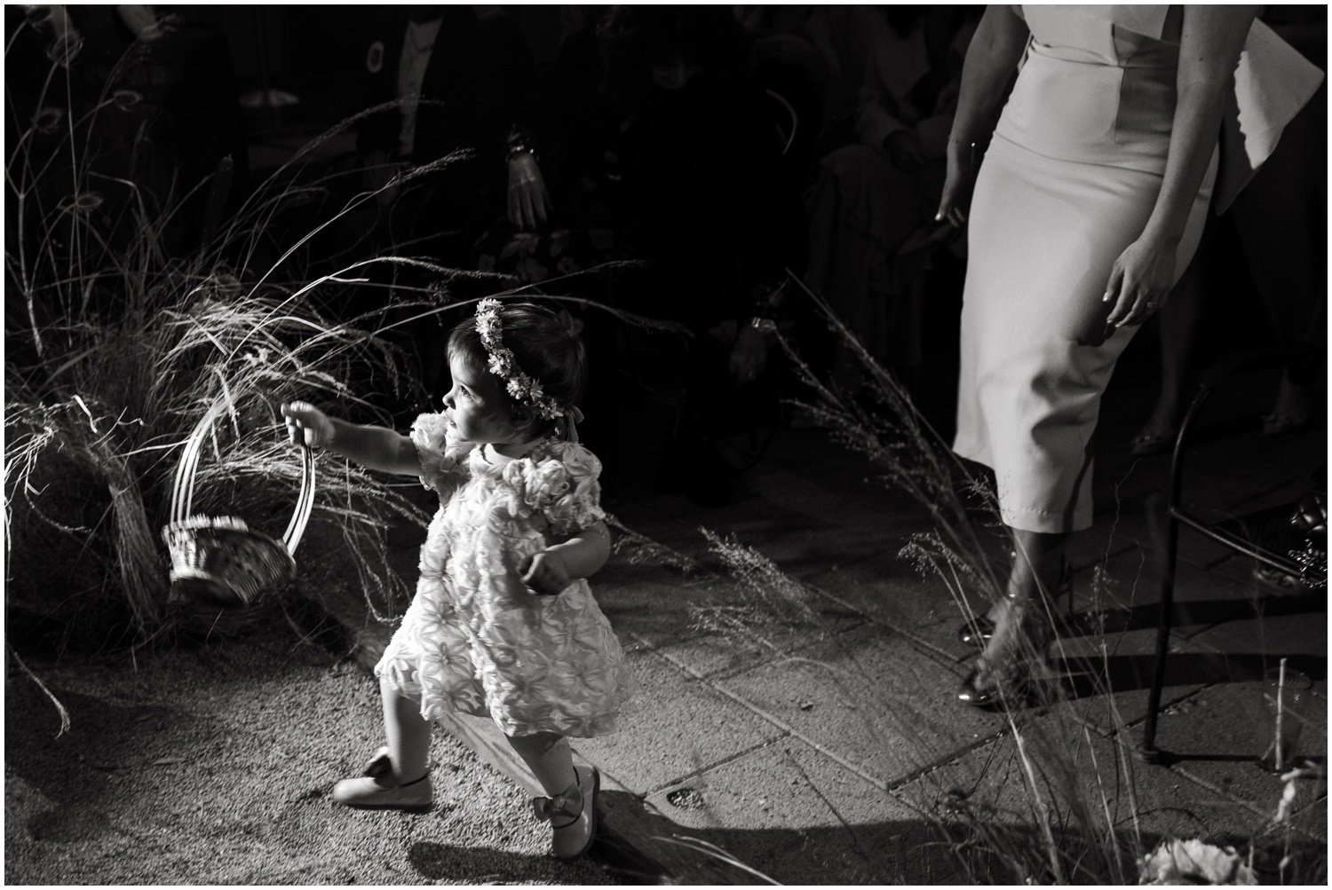 The couple's niece and flower girl walks down the aisle at their Martha Philadelphia wedding.