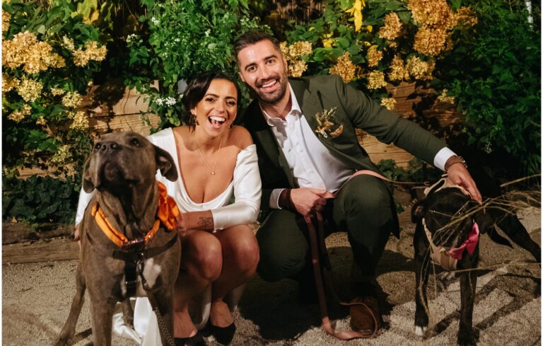 The bride and groom pose with their dogs at their Philadelphia wedding.