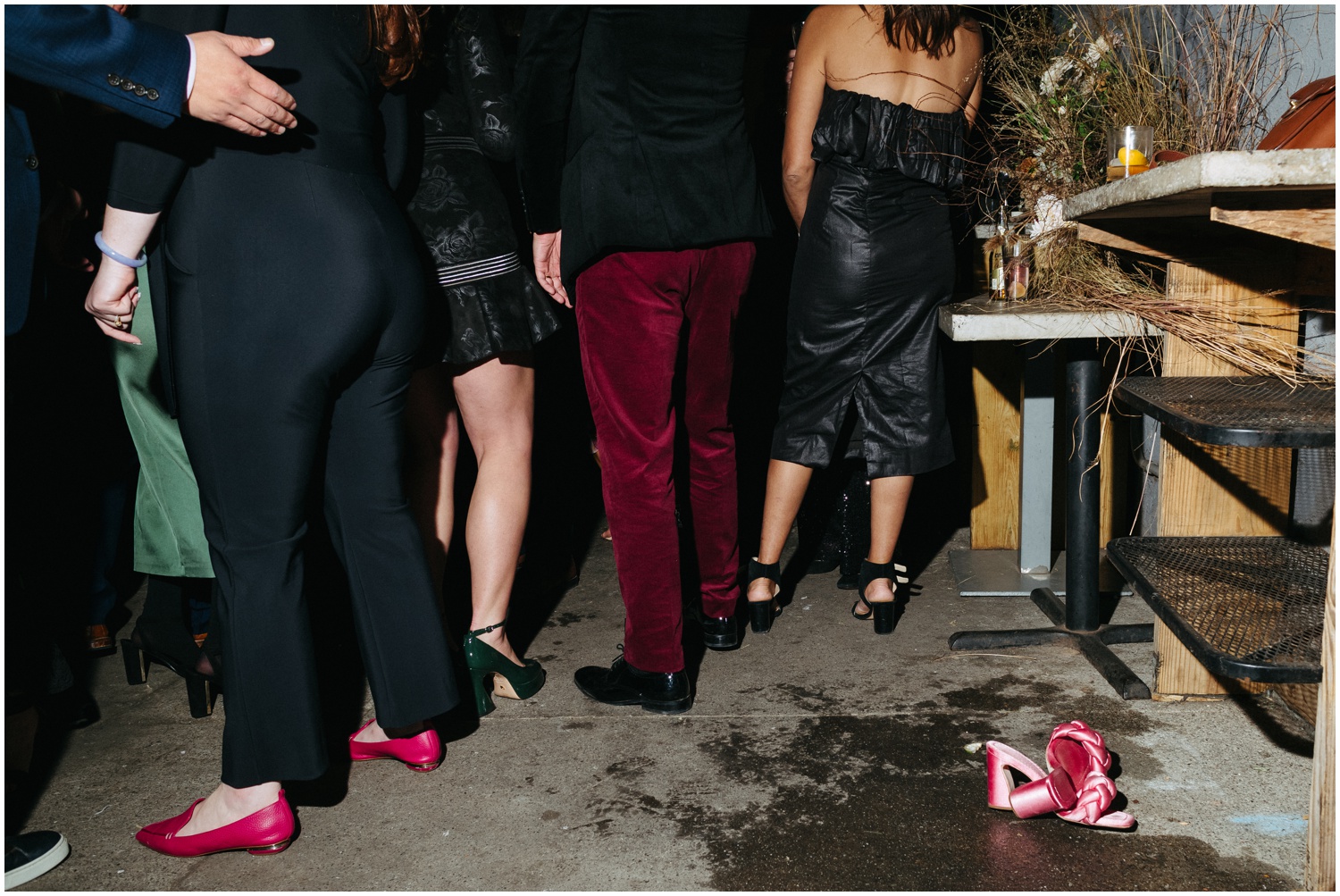 Pink shoes left on the ground at a wedding at Martha Philadelphia.